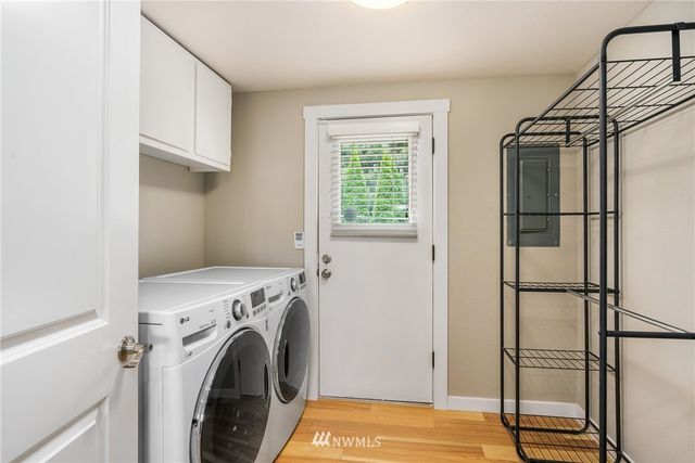 a view of a storage & utility room with washer and dryer