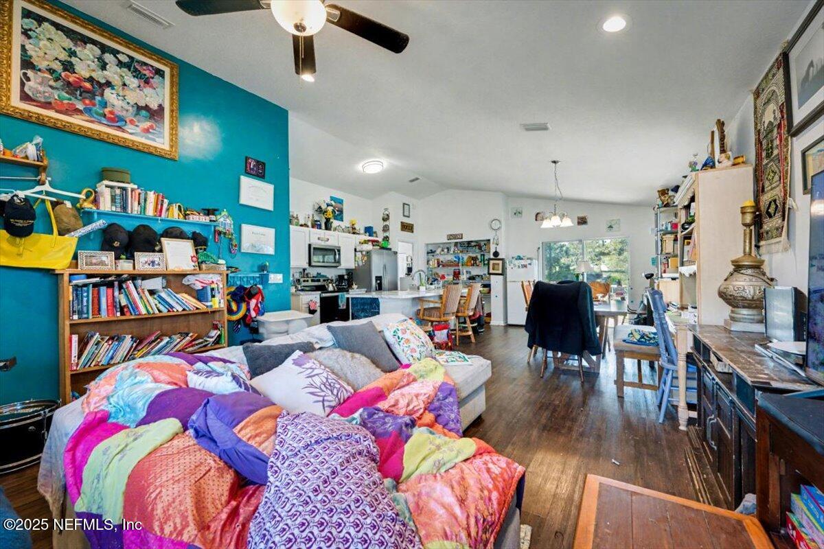 925 Scheidel Way St. Augustine, FL 32084 - Photo 4 of 10 a living room with lots of furniture and kitchen view
