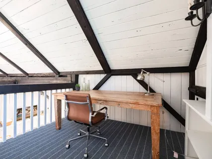 a view of furniture and wooden floor