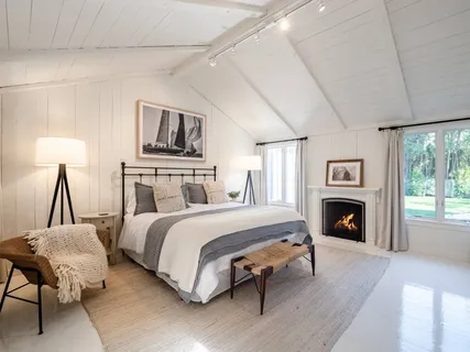 a spacious bathroom with a double vanity sink and a mirror