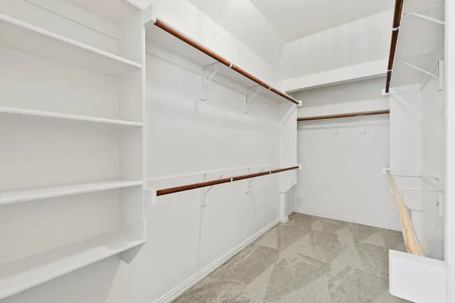 a view of an empty walk in closet