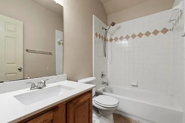 a bathroom with a sink a toilet and a bathtub