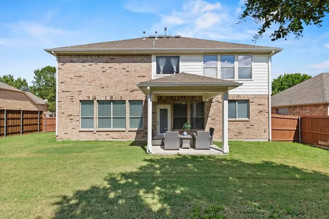 a front view of a house with a garden and porch