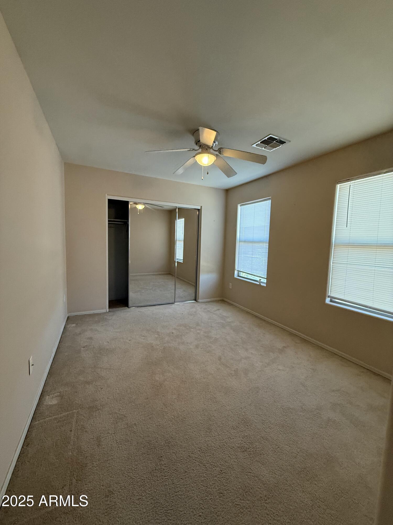 21975 East Vía Del Palo Queen Creek, AZ 85142 - Photo 13 of 19 a view of an empty room with window and chandelier