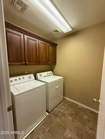 an empty room with a empty space and windows