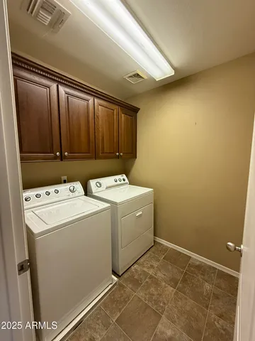 an empty room with a empty space and windows