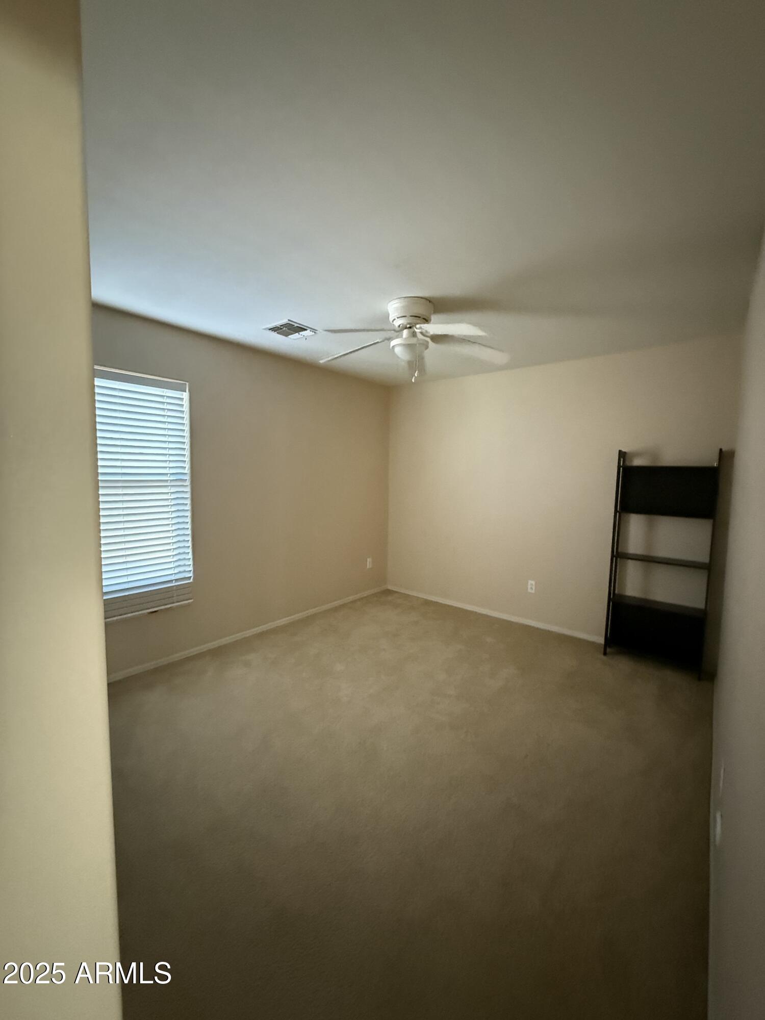 21975 East Vía Del Palo Queen Creek, AZ 85142 - Photo 16 of 19 a view of an empty room with a window