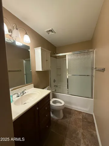 a room with a baby crib and a dresser