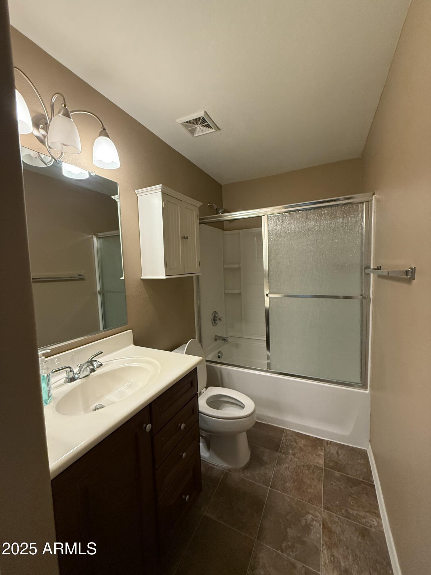 21975 East Vía Del Palo Queen Creek, AZ 85142 - Photo 17 of 19 a bathroom with a sink a toilet and shower