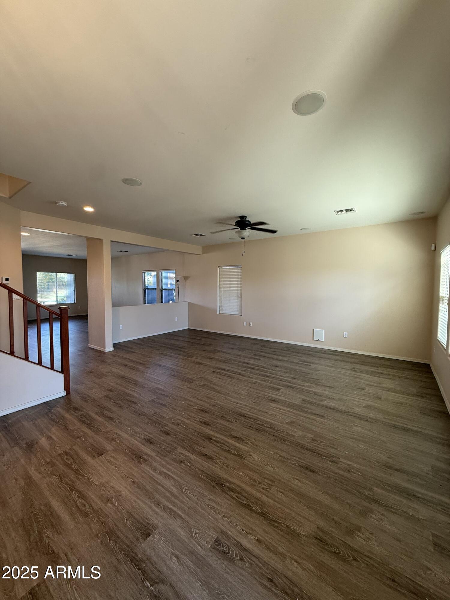 21975 East Vía Del Palo Queen Creek, AZ 85142 - Photo 7 of 19 wooden floor in an empty room with window and wooden floor