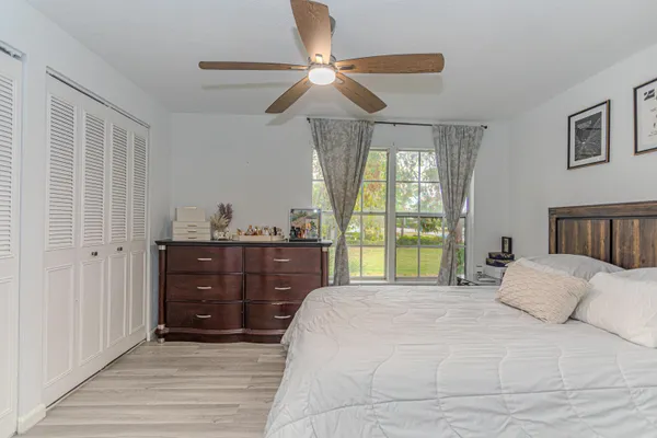 a bedroom with a bed and window