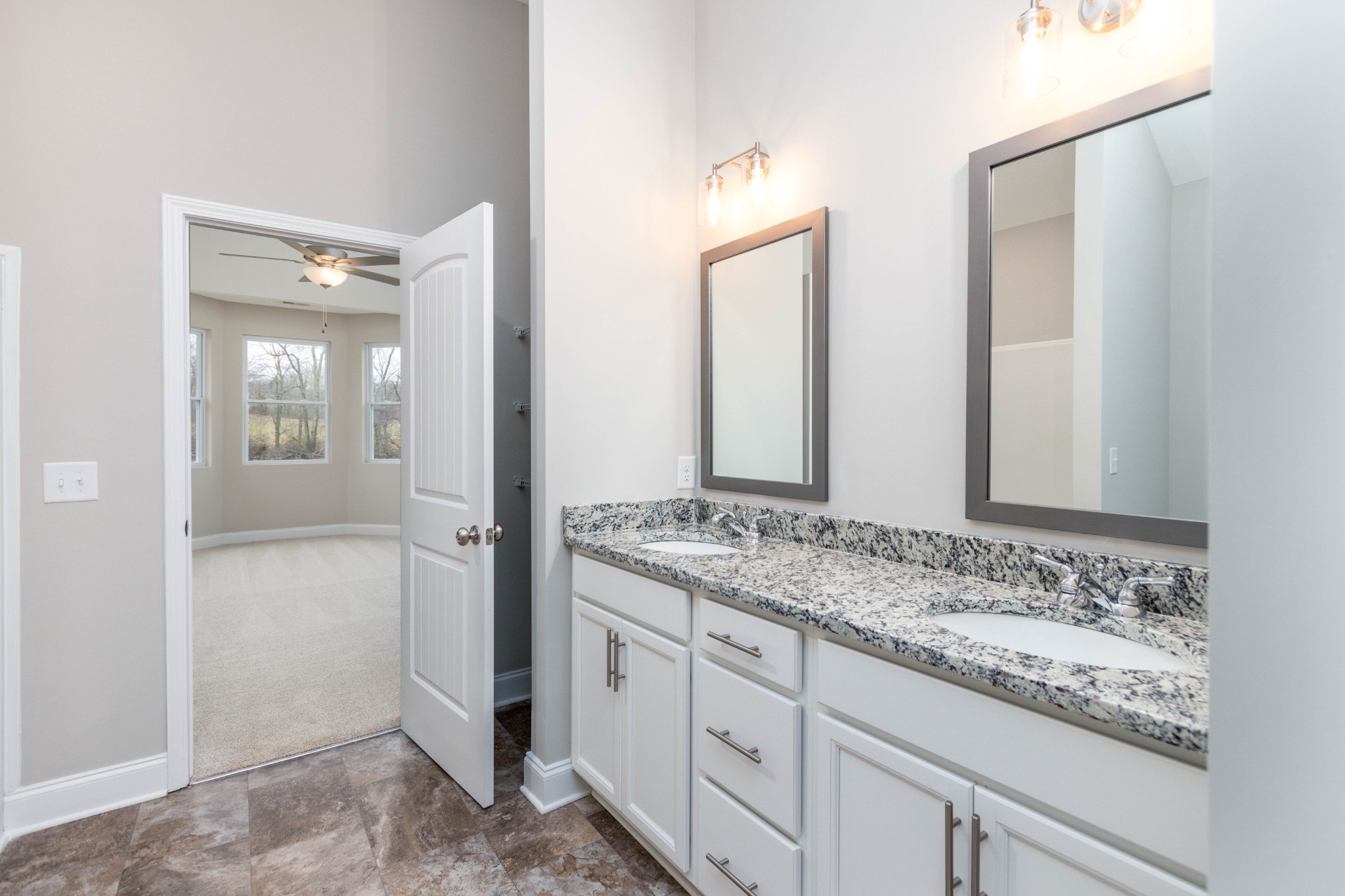 1063 East Piney Road Dickson, TN 37055 - Photo 14 of 22 a bathroom with a granite countertop sink and a mirror