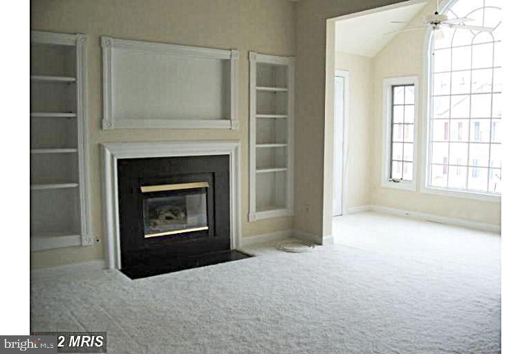 8303 Bluebird Way, Unit M Lorton, VA 22079 - Photo 3 of 9 a living room with furniture and a fireplace