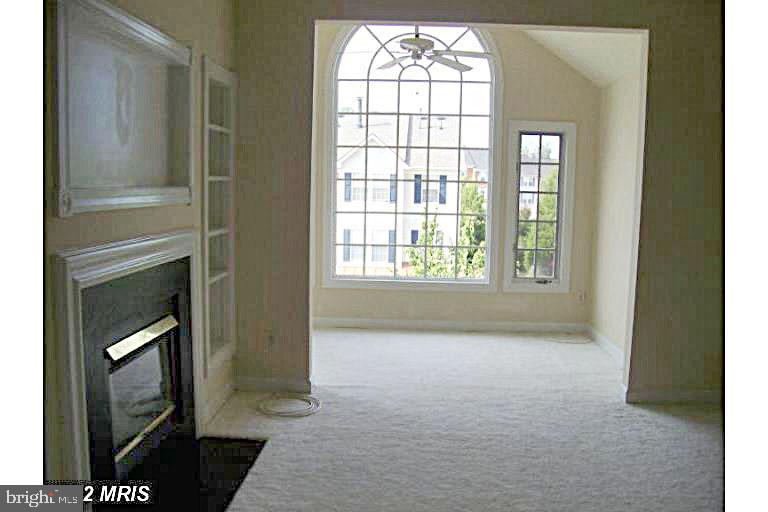 8303 Bluebird Way, Unit M Lorton, VA 22079 - Photo 4 of 9 a view of empty room with windows