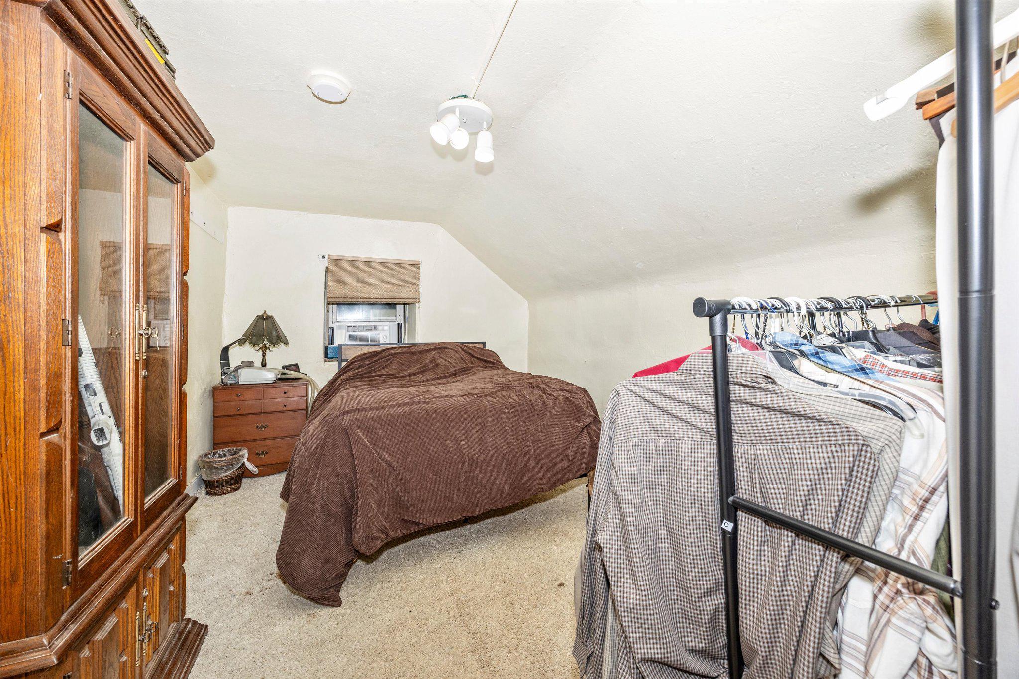 14721 Albert Staub Road Thurmont, MD 21788 - Photo 29 of 46 a bedroom with a bed and a large mirror next to a window