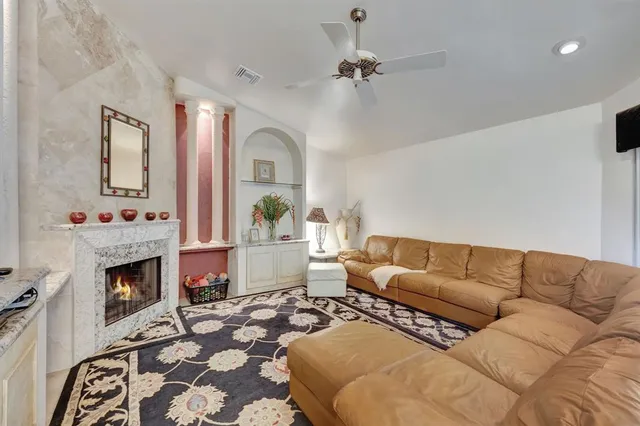 a bed room with a bed and a chair