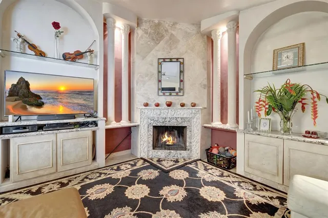 a bedroom with furniture and a chandelier