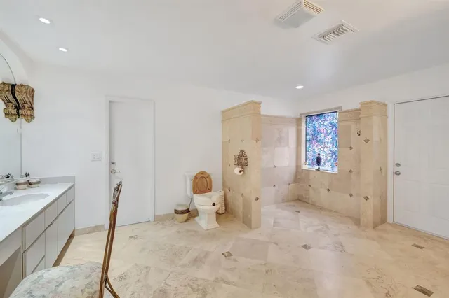a room with furniture a rug and a book shelf