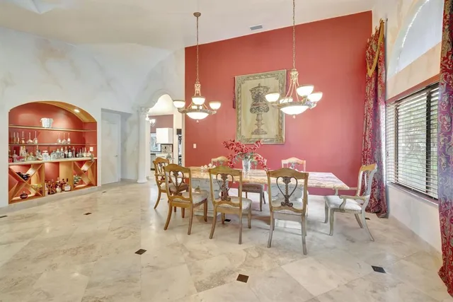 a large kitchen with stainless steel appliances granite countertop a stove oven and a sink