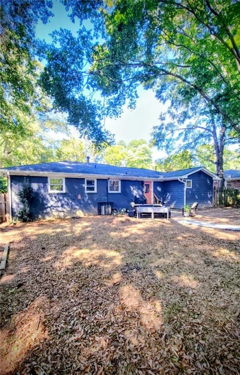 3267 Bonway Drive Decatur, GA 30032 - Photo 21 of 21 a view of a yard with a tree and wooden fence