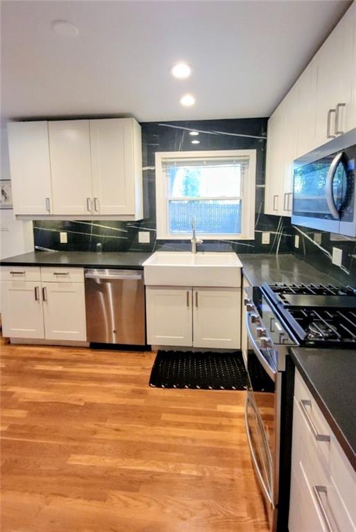 3267 Bonway Drive Decatur, GA 30032 - Photo 3 of 21 a kitchen with stainless steel appliances a sink and stove