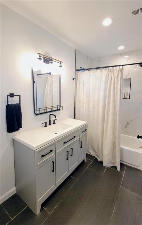 3267 Bonway Drive Decatur, GA 30032 - Photo 9 of 21 a bathroom with a double vanity sink and mirror