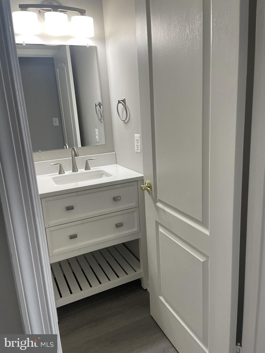 8343 Montgomery Run Road Ellicott City, MD 21043 - Photo 28 of 36 Sleek modern bathroom with elegance.