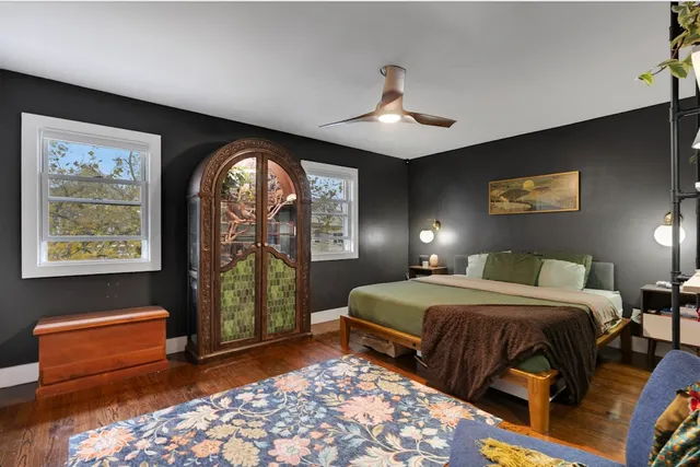 a bedroom with double bed and a window