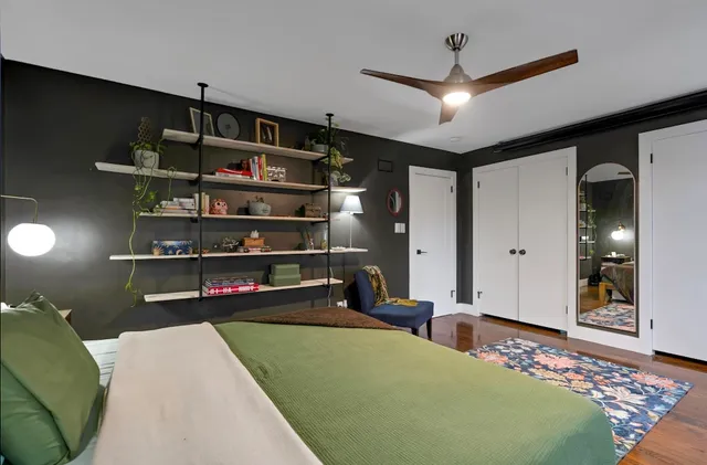 a bedroom with a bed and closet