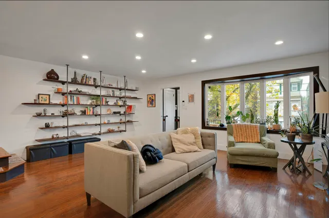a living room with furniture and a large window