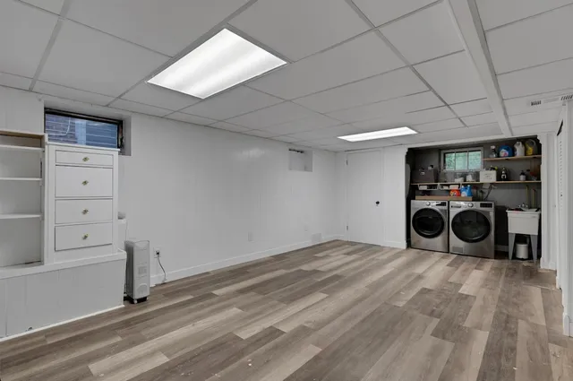 a view of a storage & utility room with two washing machine