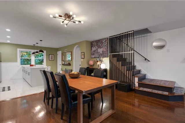 a view of a dining room with furniture window and wooden floor