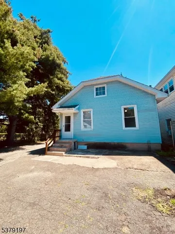 a backyard of a house with yard and trees