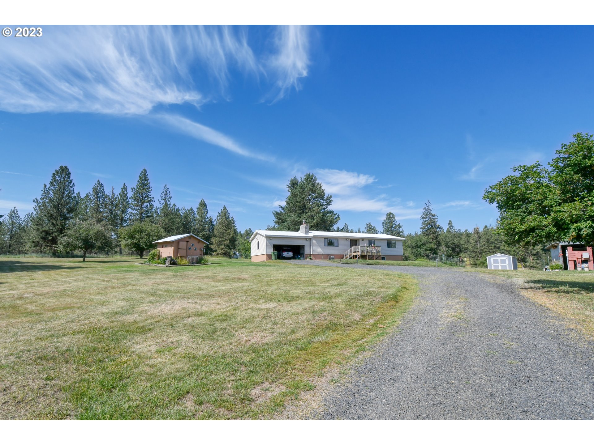 49414 County 1028 Road Pendleton, OR 97801 - Photo 2 of 48 a house with a yard