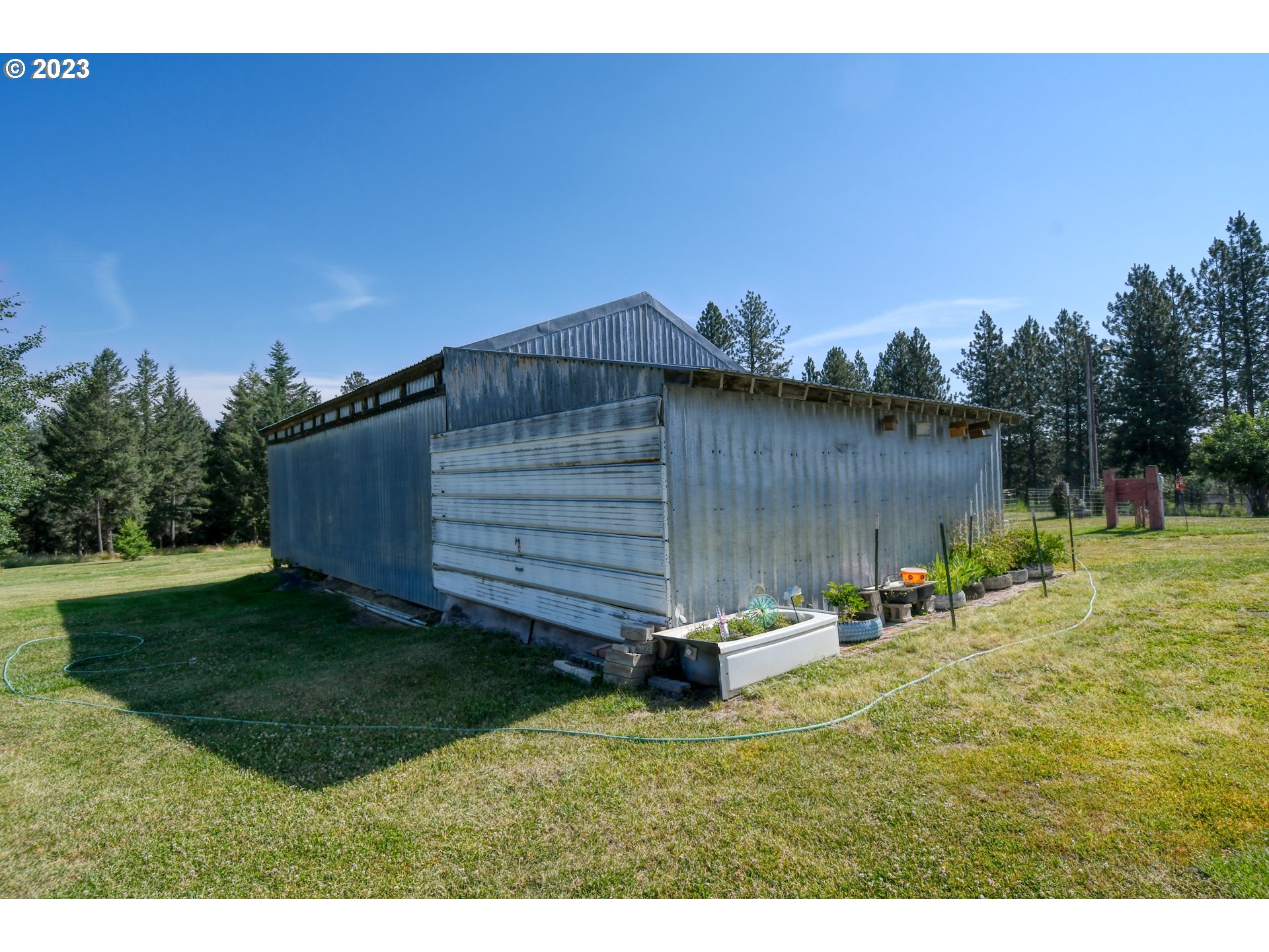 49414 County 1028 Road Pendleton, OR 97801 - Photo 32 of 48 a backyard of a house with table and chairs