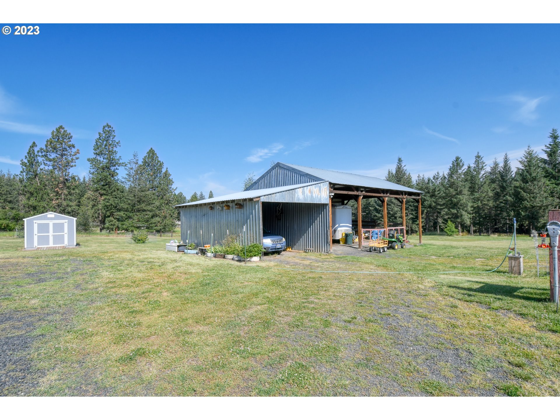 49414 County 1028 Road Pendleton, OR 97801 - Photo 41 of 48 a yellow house with trees in the background