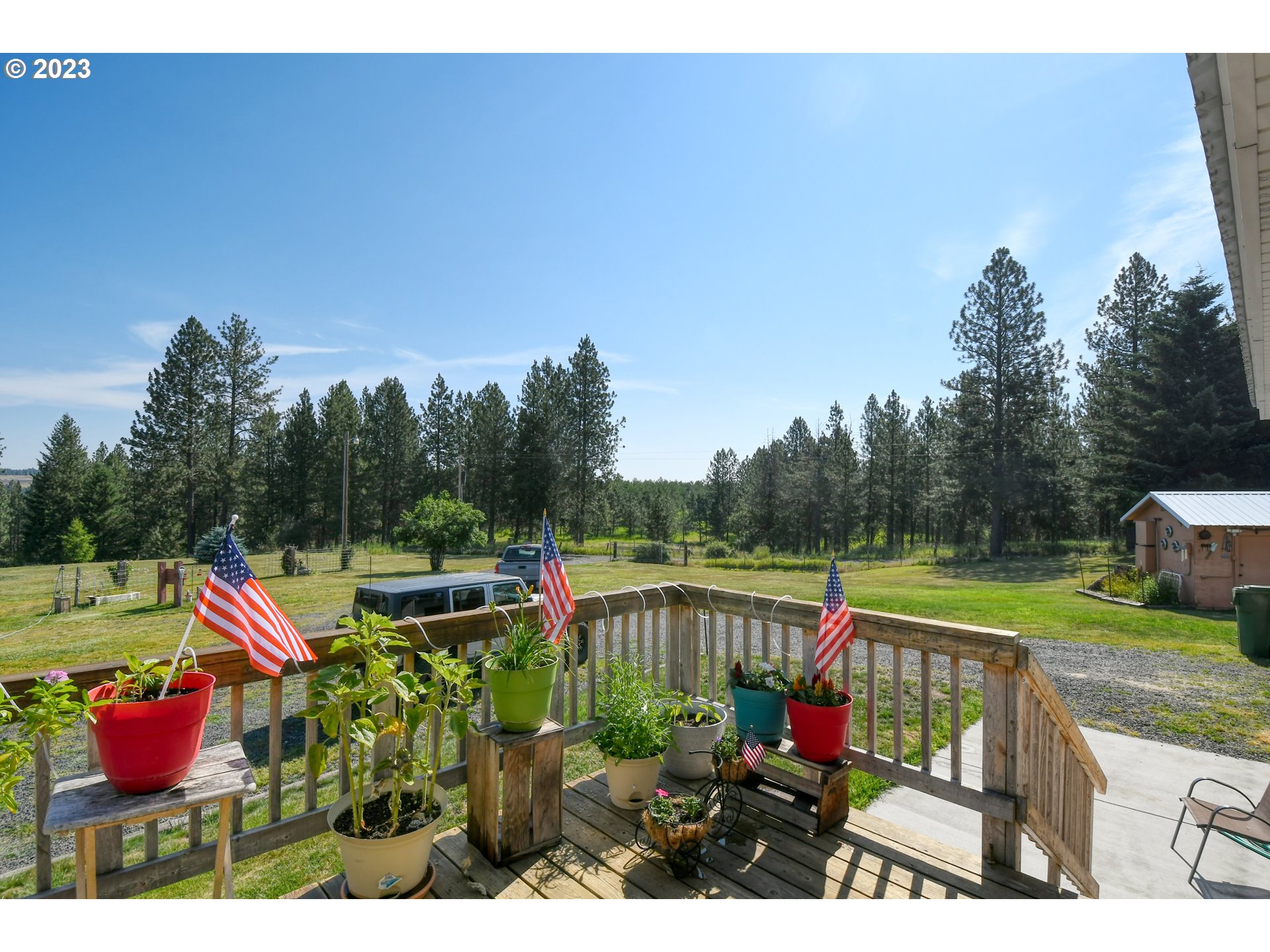 49414 County 1028 Road Pendleton, OR 97801 - Photo 6 of 48 a view of a wooden deck and a yard