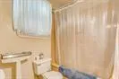a bathroom with a shower curtain and curtain
