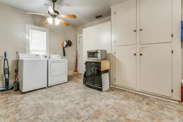 a view of a kitchen with electric appliances