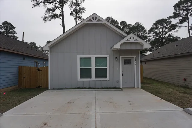 a view of house with yard