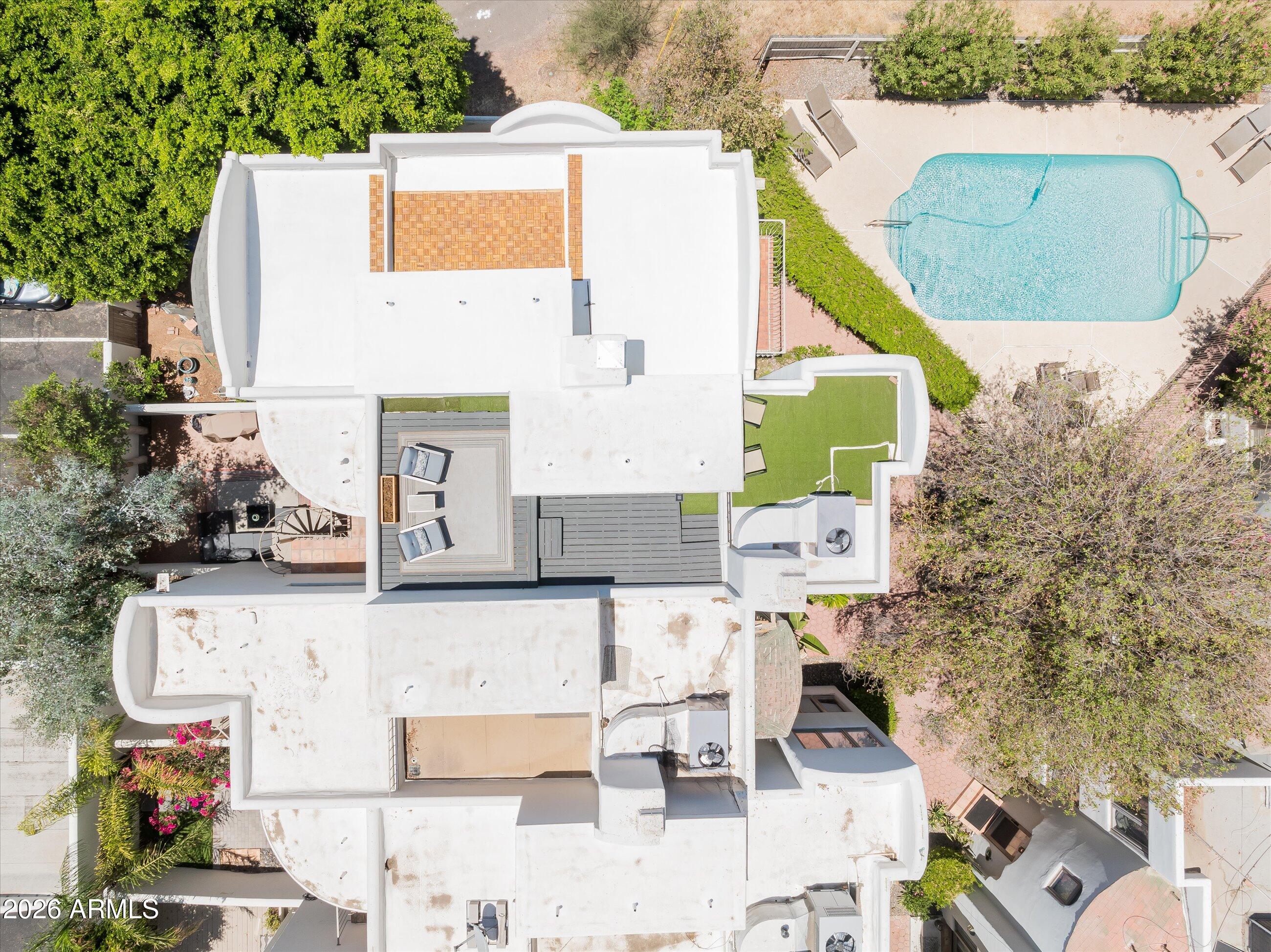 4955 East Indian School Road, Unit 9 Phoenix, AZ 85018 - Photo 21 of 25 an aerial view of residential houses with outdoor space and trees
