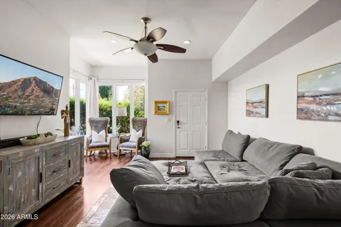 a living room with furniture and a large window