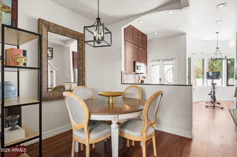a view of a dining room with furniture window and wooden floor