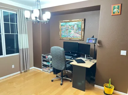 a workspace with furniture and window