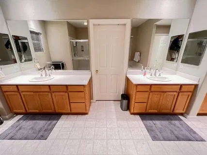 a bathroom with a sink a vanity and a mirror