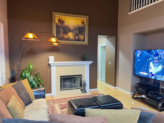 a living room with furniture and a fireplace