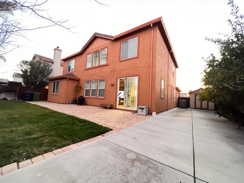 484 Presidio Place Tracy, CA 95377 - Photo 39 of 40 a front view of a house with a yard and garage