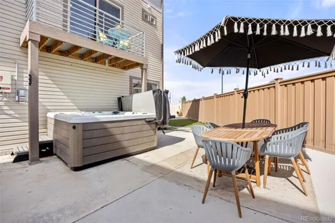 a view of balcony with chairs and wooden floor