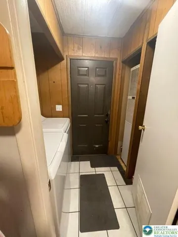 a bathroom with a glass door shower and toilet