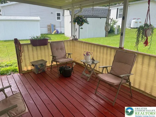 a view of outdoor seating space with wooden floor